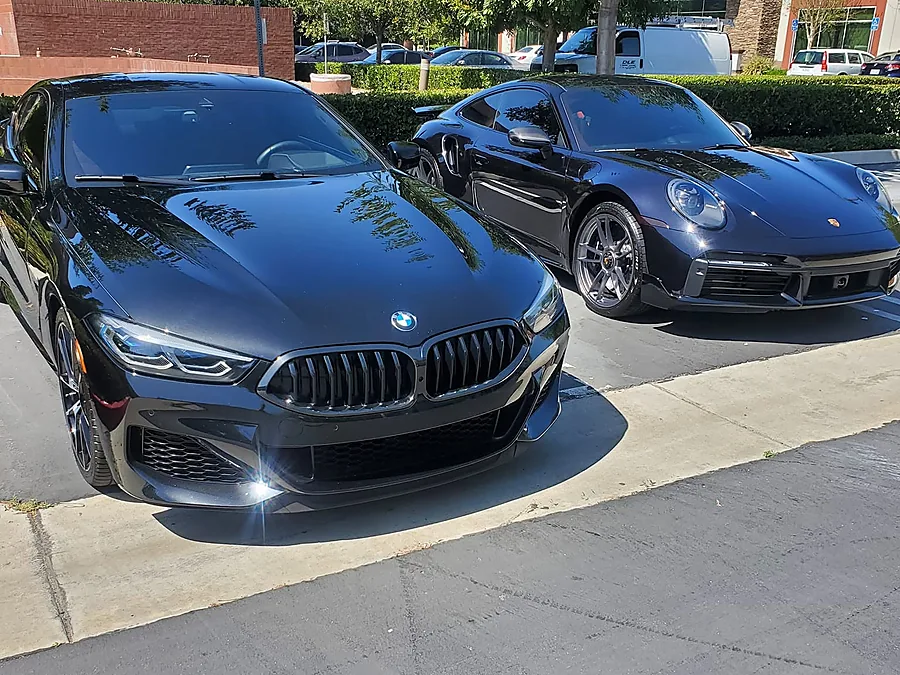 Detailed black BMW and Porsche
