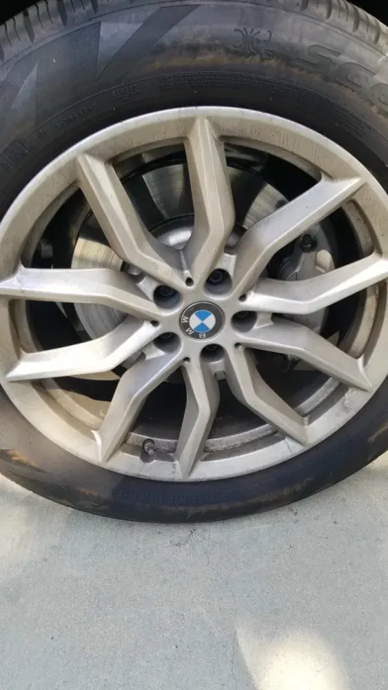 BMW wheel dirty before cleanup