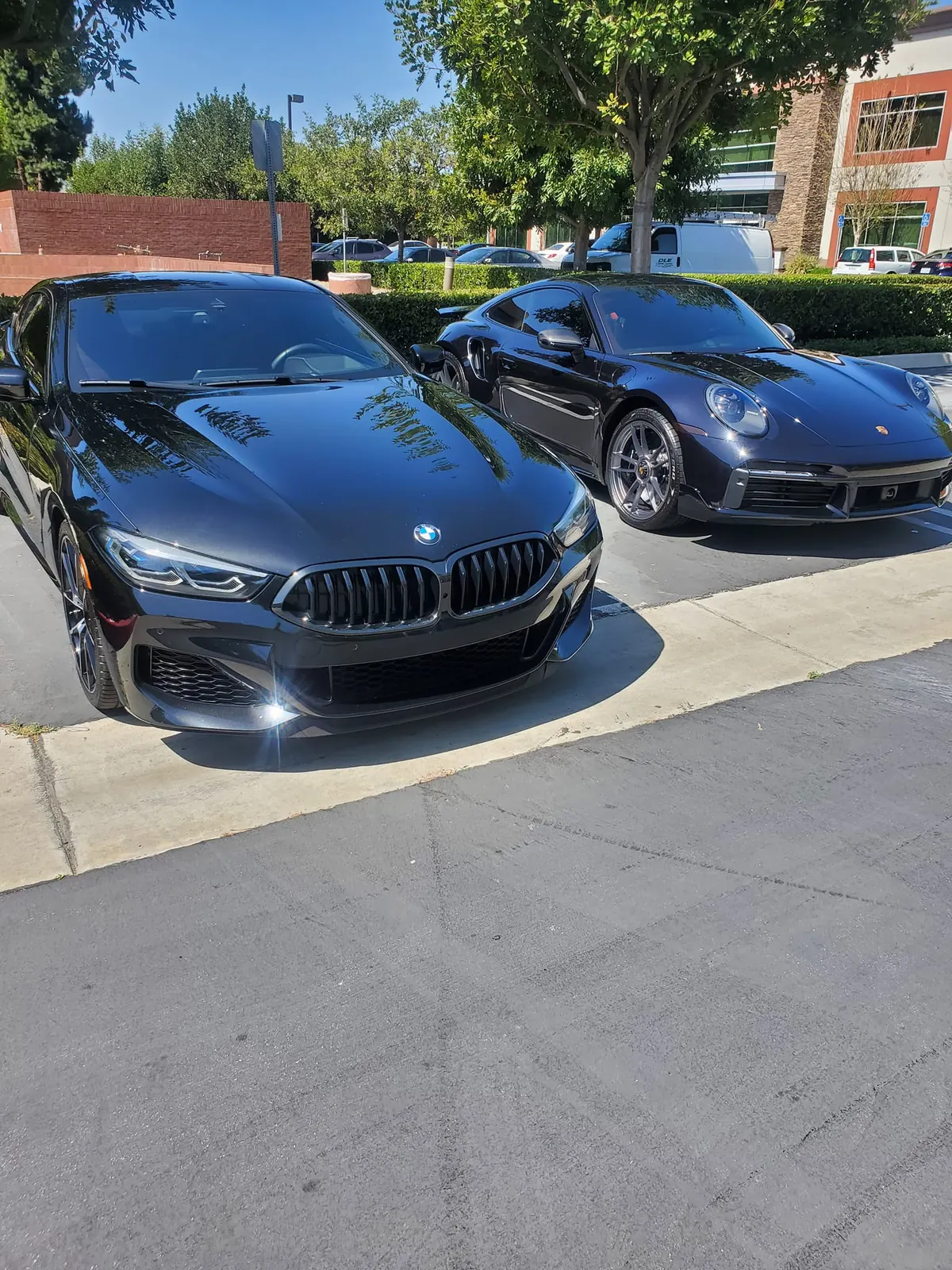 BMW and Porsche detailed and parked clean